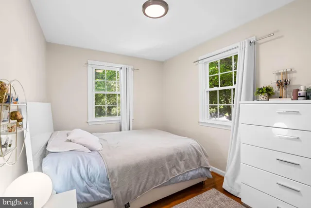 a kitchen with stainless steel appliances kitchen island granite countertop a refrigerator and a sink