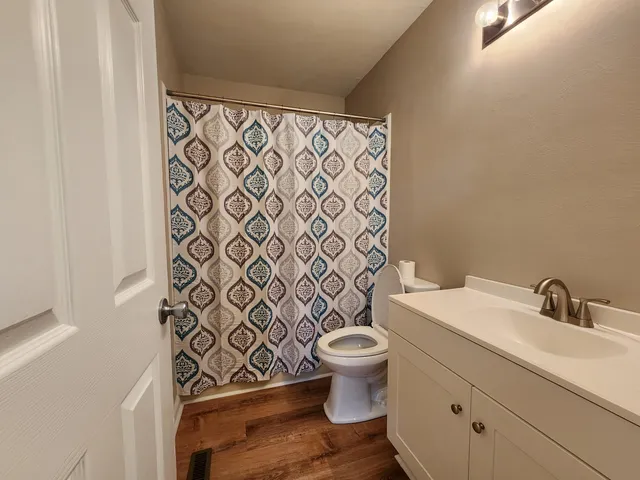 a bathroom with a toilet and a sink