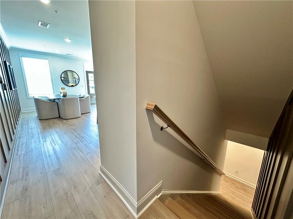 518 Alice Way, Unit D13 Cumming, GA 30040 - Photo 4 of 51 a view of a hallway with a couch