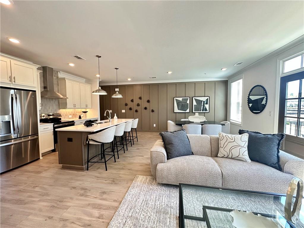 518 Alice Way, Unit D13 Cumming, GA 30040 - Photo 10 of 51 a living room with furniture and kitchen view
