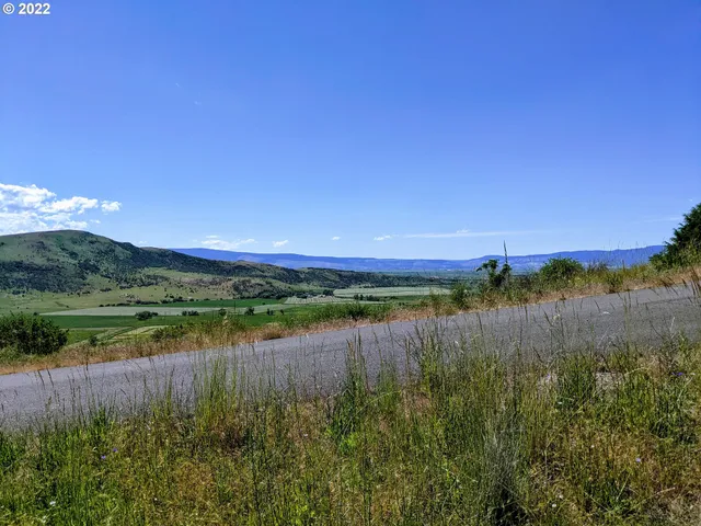 a view of a lake with a yard