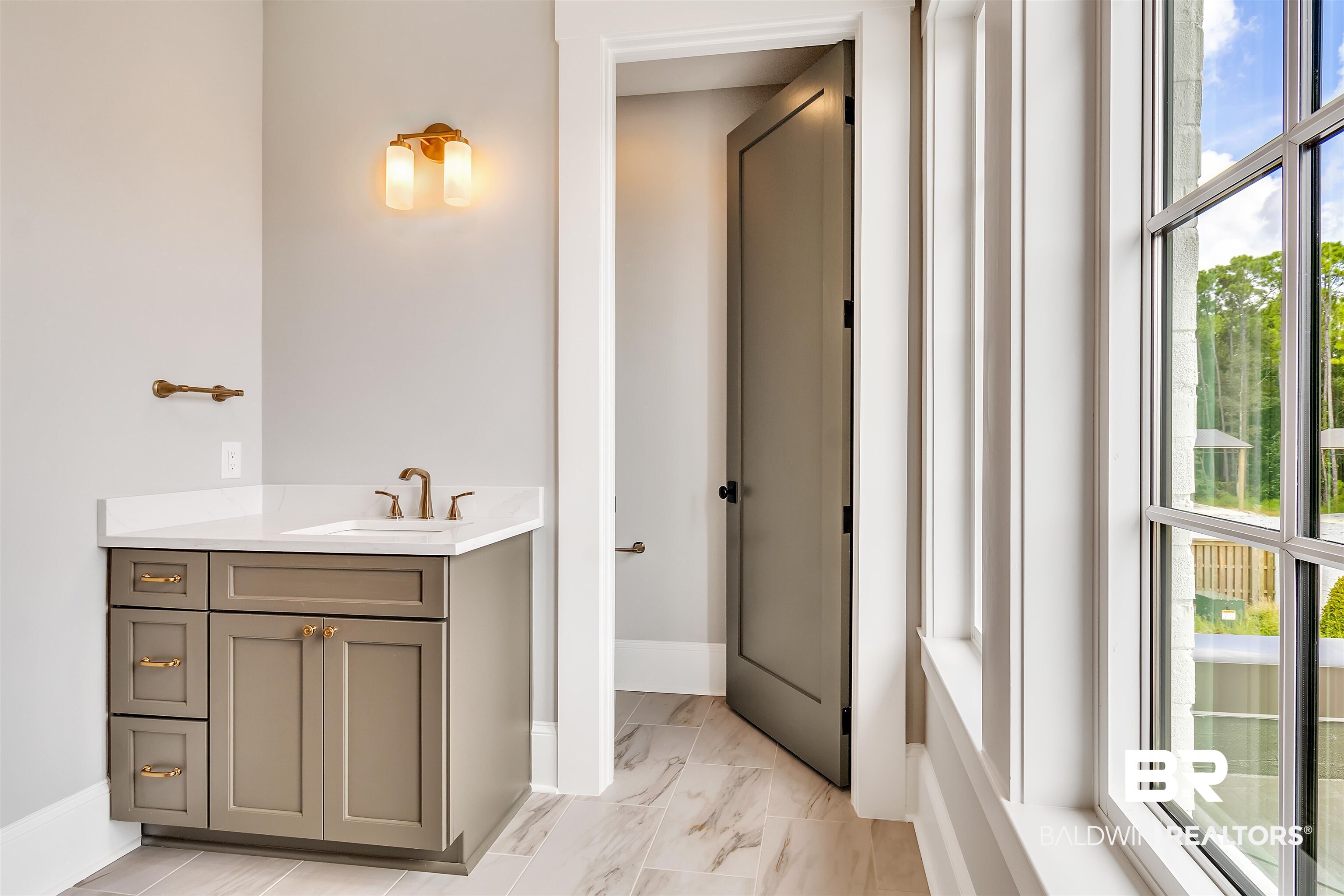 829 Inlet Circle Gulf Shores, AL 36542 - Photo 20 of 31 Bathroom featuring a wealth of natural light and vanity