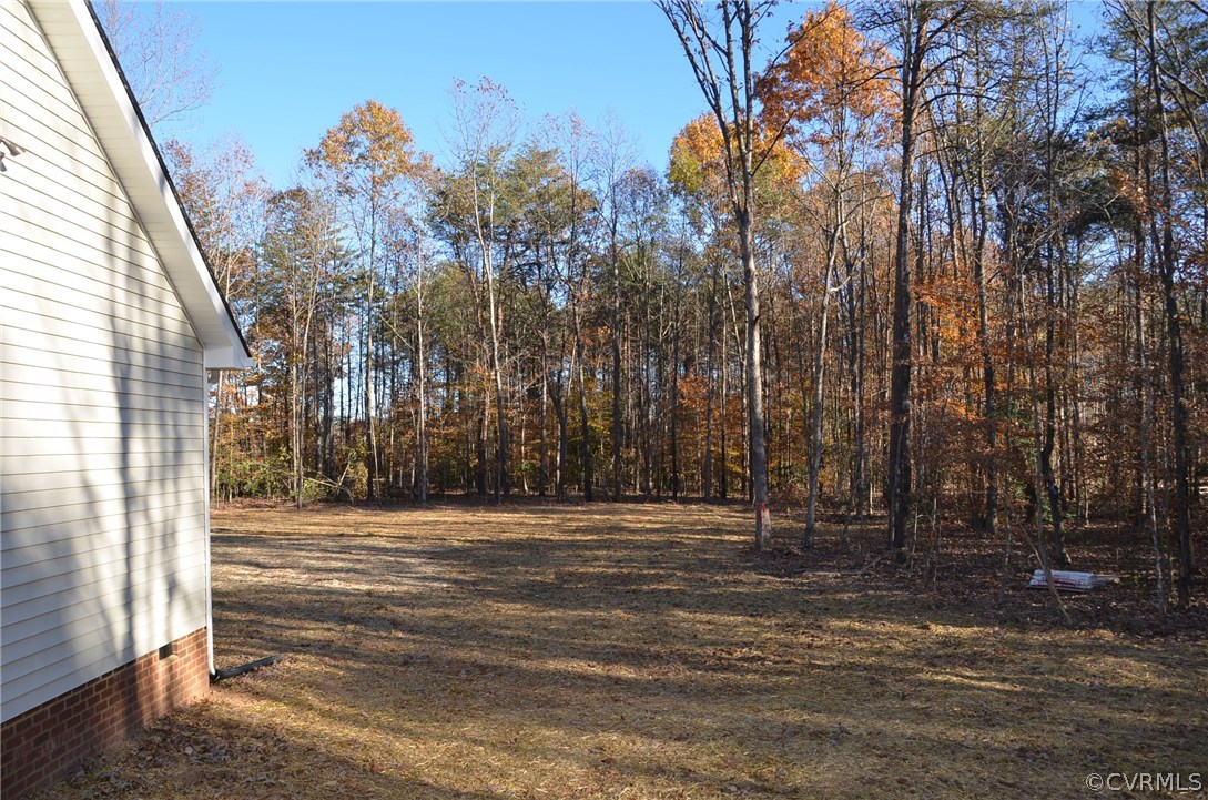 1118 Signboard Road Bumpass, VA 23024 - Photo 23 of 26 a view of a backyard of the house