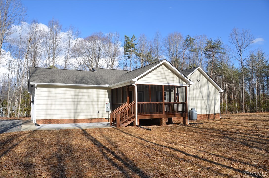 1118 Signboard Road Bumpass, VA 23024 - Photo 26 of 26 a view of a house with a yard and garage