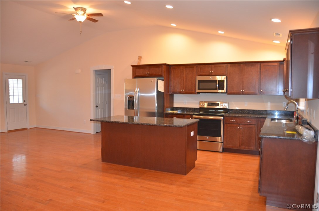 1118 Signboard Road Bumpass, VA 23024 - Photo 3 of 26 a kitchen with stainless steel appliances granite countertop a stove a sink and a refrigerator