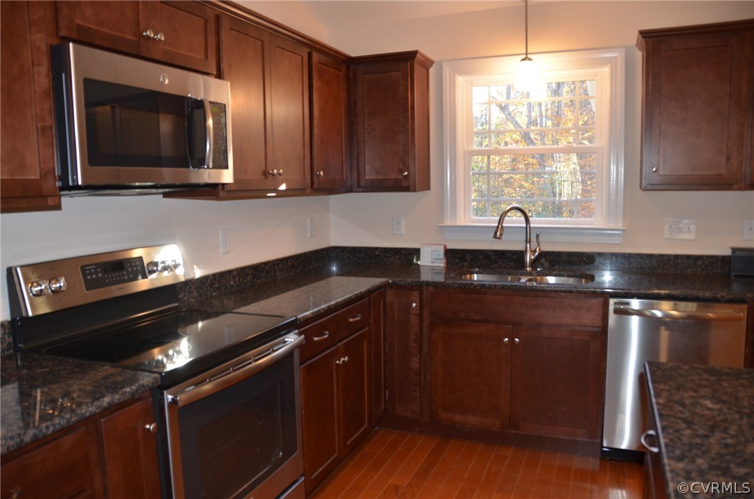 1118 Signboard Road Bumpass, VA 23024 - Photo 6 of 26 a kitchen with a sink stove and microwave