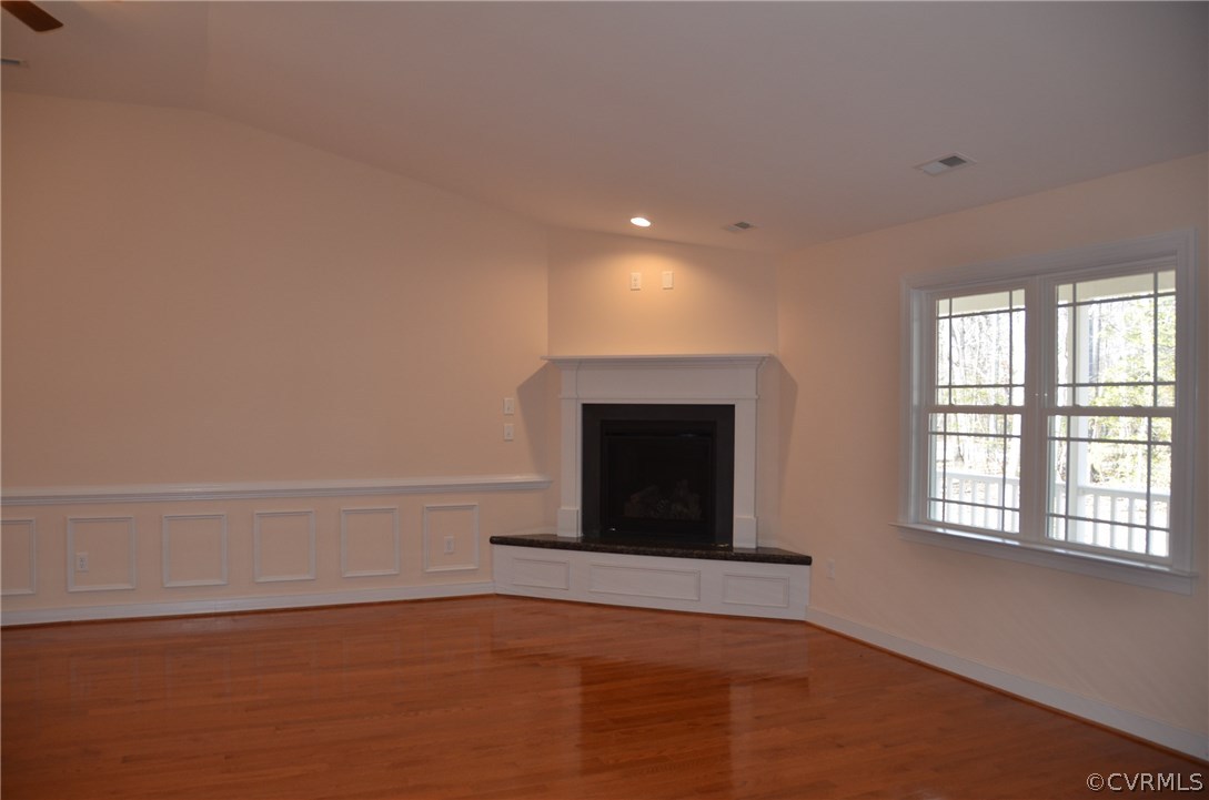 1118 Signboard Road Bumpass, VA 23024 - Photo 7 of 26 a view of an empty room with a fireplace and a window