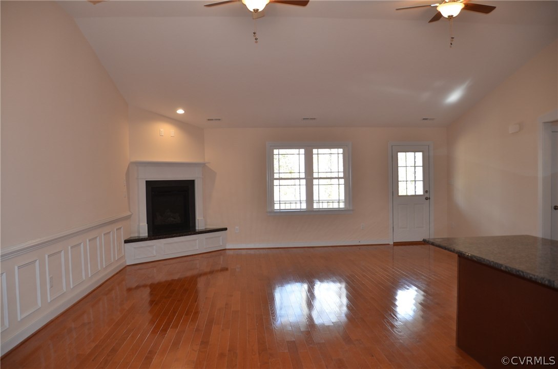 1118 Signboard Road Bumpass, VA 23024 - Photo 8 of 26 a view of an empty room with wooden floor and a window