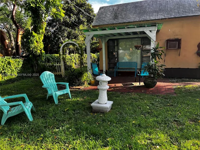 a front view of a house with garden and porch