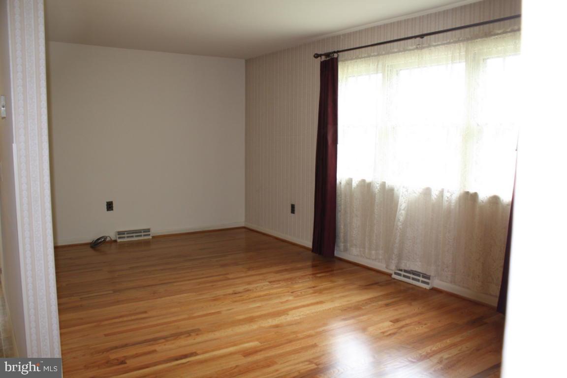 503 West Marion Street Lititz, PA 17543 - Photo 4 of 10 a view of an empty room with wooden floor and a window