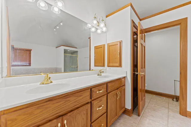 a bathroom with a sink vanity and a mirror