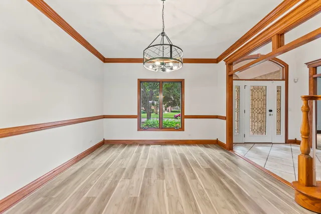 a view of an entryway with wooden floor