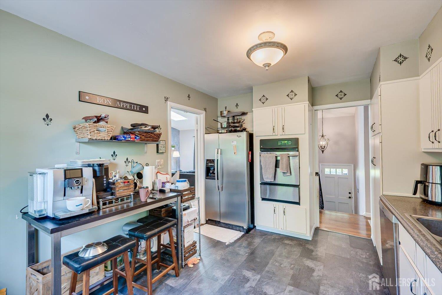 12 Gales Road Edison, NJ 08837 - Photo 14 of 35 a kitchen with stainless steel appliances a refrigerator and a stove