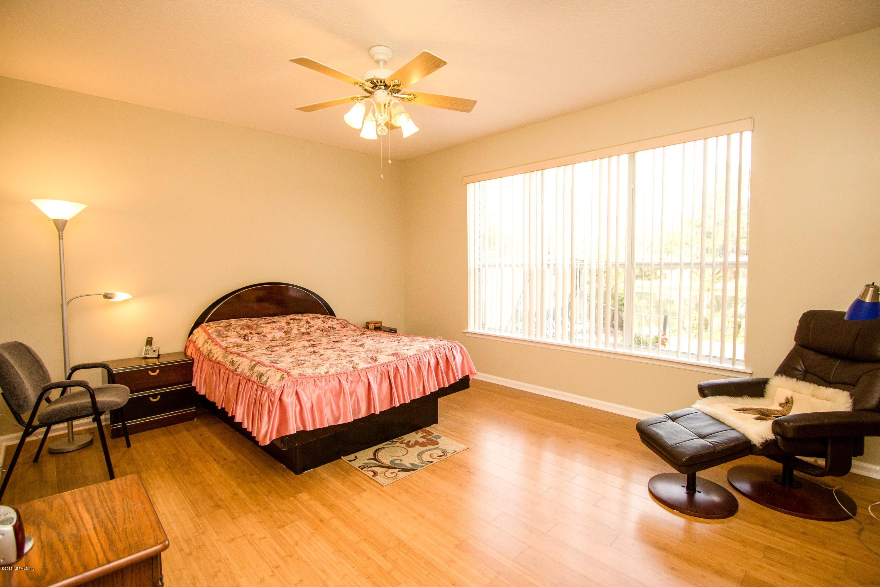 2520 Benjamin Road Jacksonville, FL 32223 - Photo 17 of 33 a living room with a bed furniture and a large window