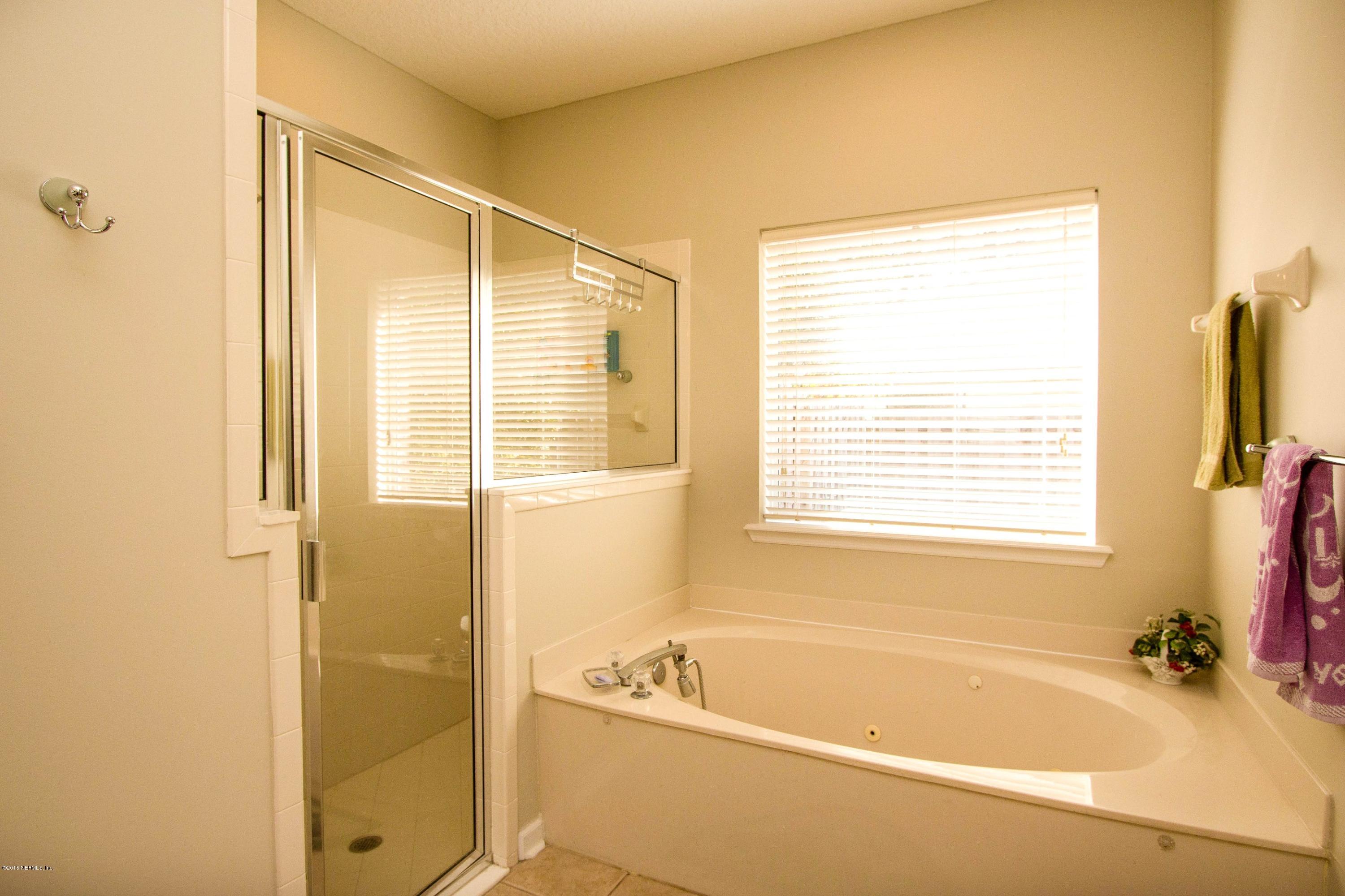 2520 Benjamin Road Jacksonville, FL 32223 - Photo 19 of 33 a white bath tub sitting next to a window