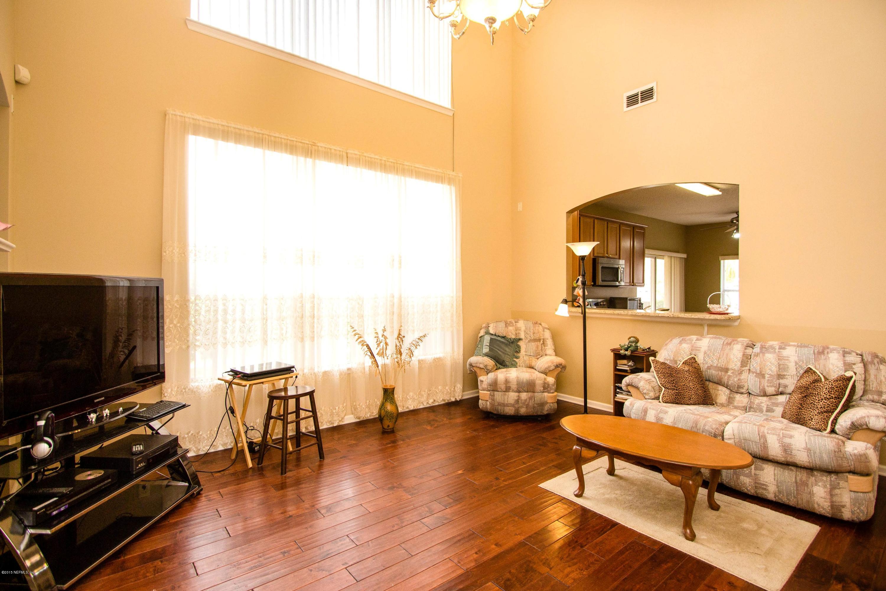 2520 Benjamin Road Jacksonville, FL 32223 - Photo 9 of 33 a living room with furniture and a flat screen tv
