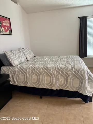 a bedroom with a bed
