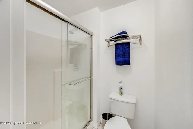 a close view of a utility room with dryer and washer