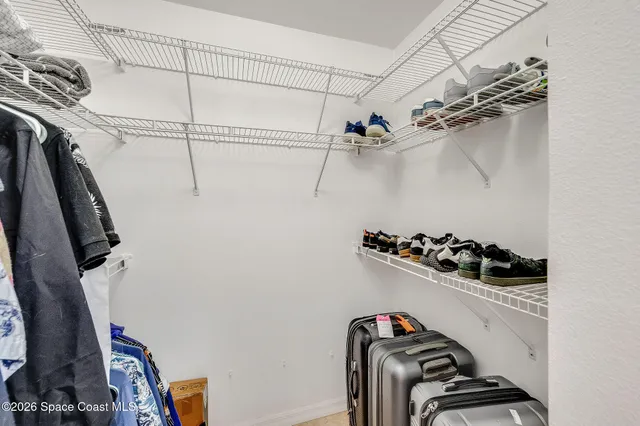 a view of a livingroom with a ceiling fan and window