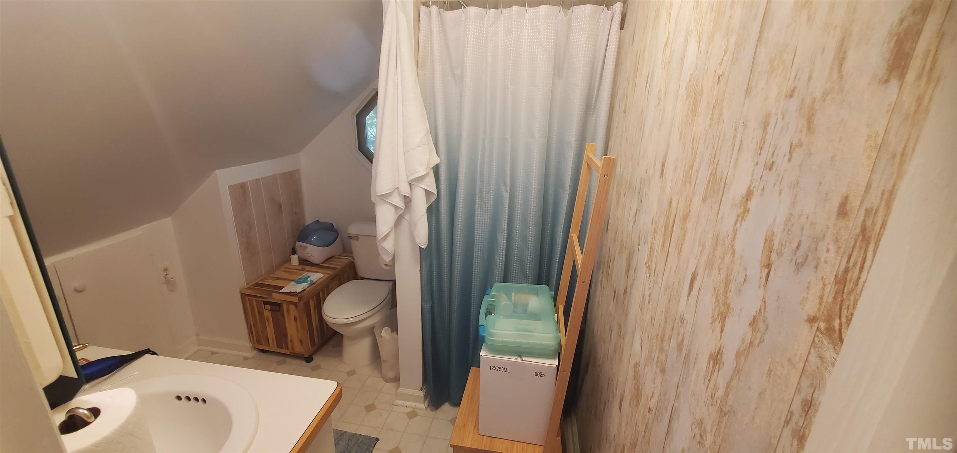 11201 Old Creedmoor Road Raleigh, NC 27613 - Photo 21 of 27 a bathroom with a sink toilet and shower