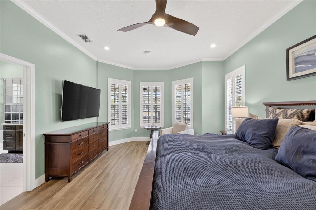 508 Islebay Drive Apollo Beach, FL 33572 - Photo 42 of 98 a bedroom with a large bed and a flat screen tv