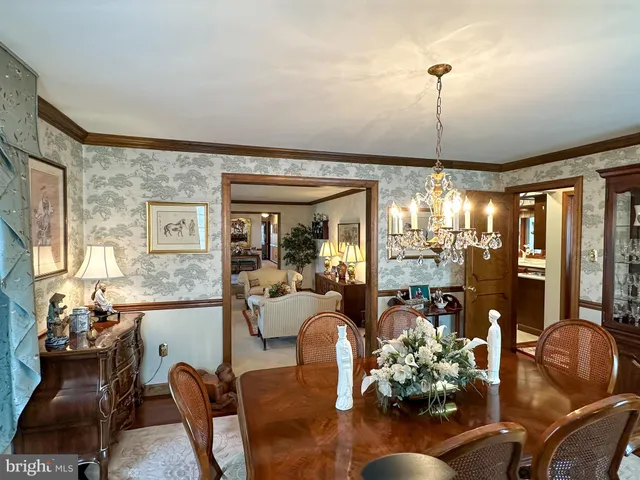 a large kitchen with stainless steel appliances granite countertop a sink and cabinets