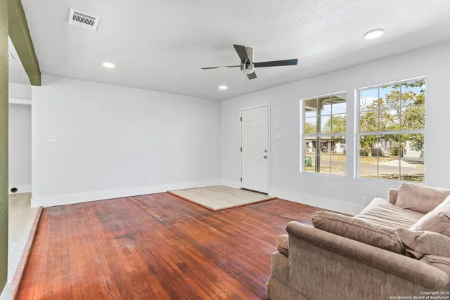 a living room with a couch and window