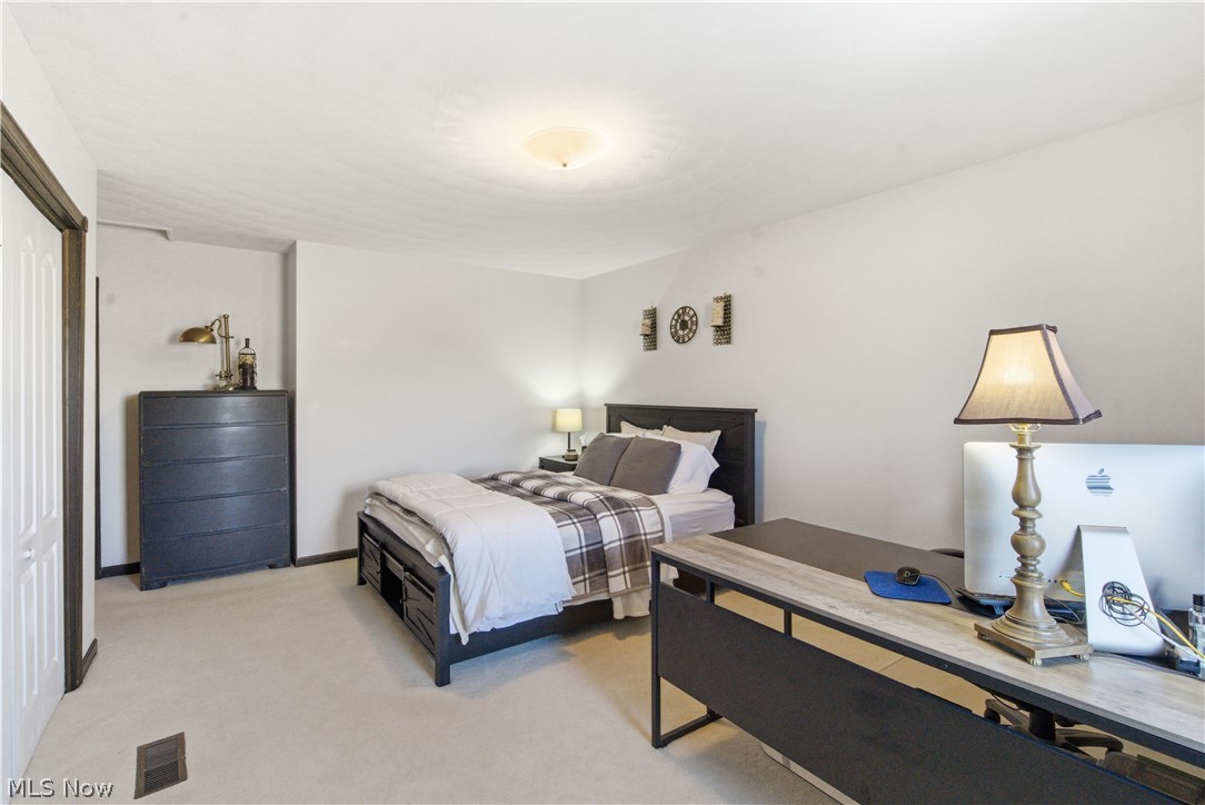 52450 Tower Road Cumberland, OH 43732 - Photo 18 of 41 Bedroom featuring light colored carpet and baseboards