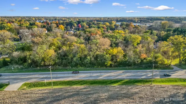 a view of a swimming pool with an outdoor space and seating area
