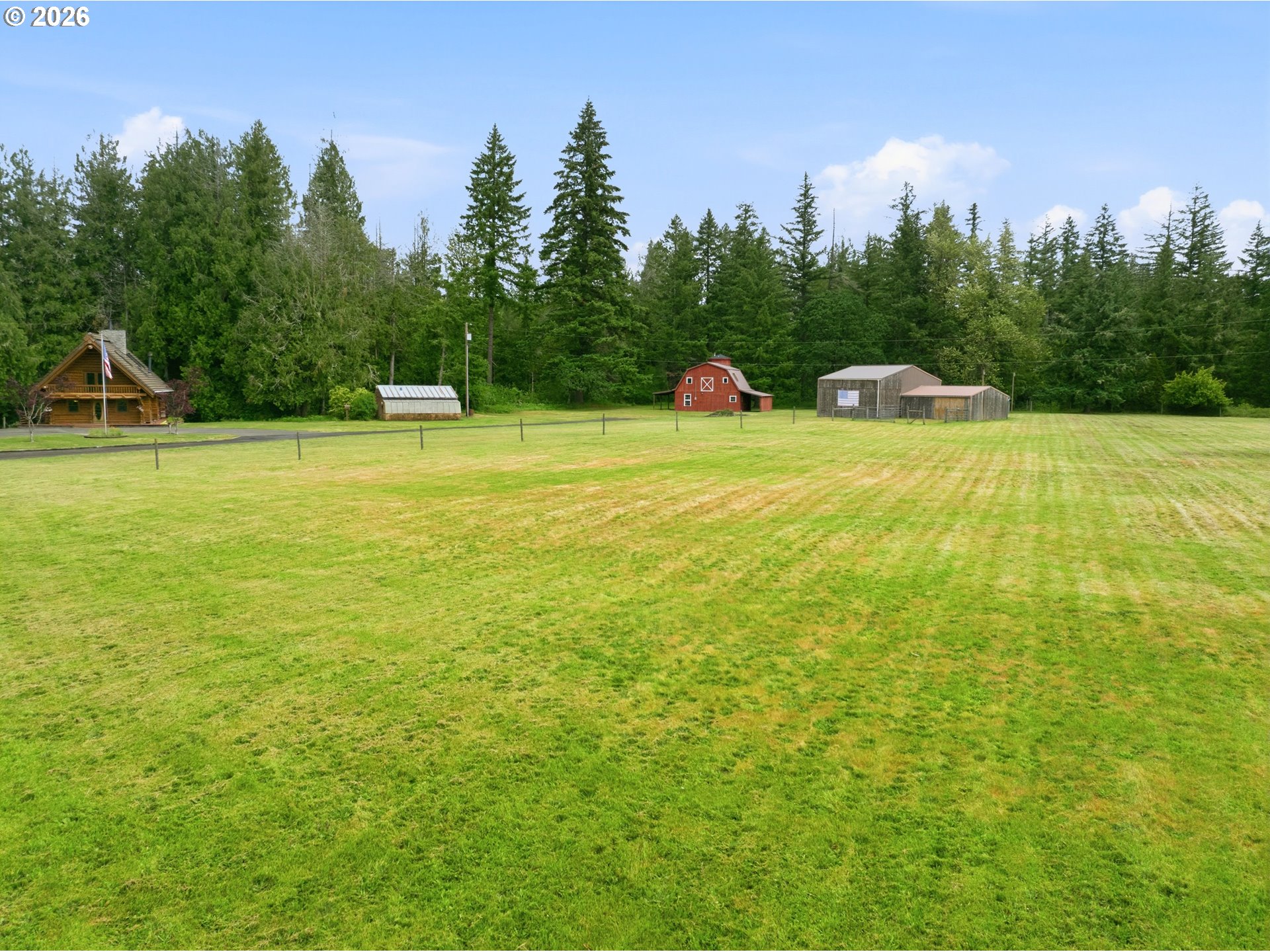 29870 South Dhooghe Road Colton, OR 97017 - Photo 33 of 48 a view of a swimming pool and trees in the background