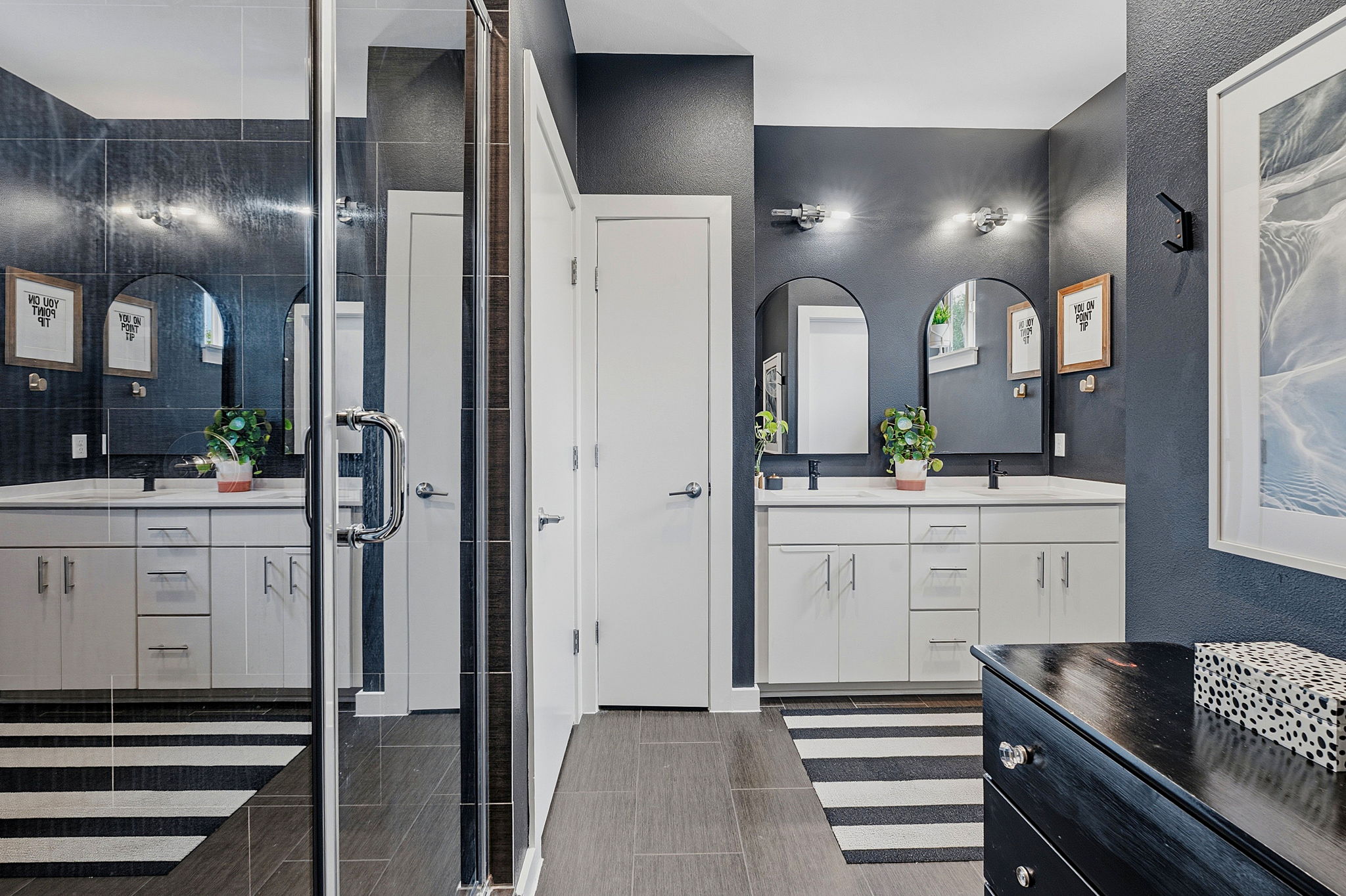 3001 Del Curto Road, Unit 31 Austin, TX 78704 - Photo 21 of 32 a bathroom with a double vanity sink and a mirror