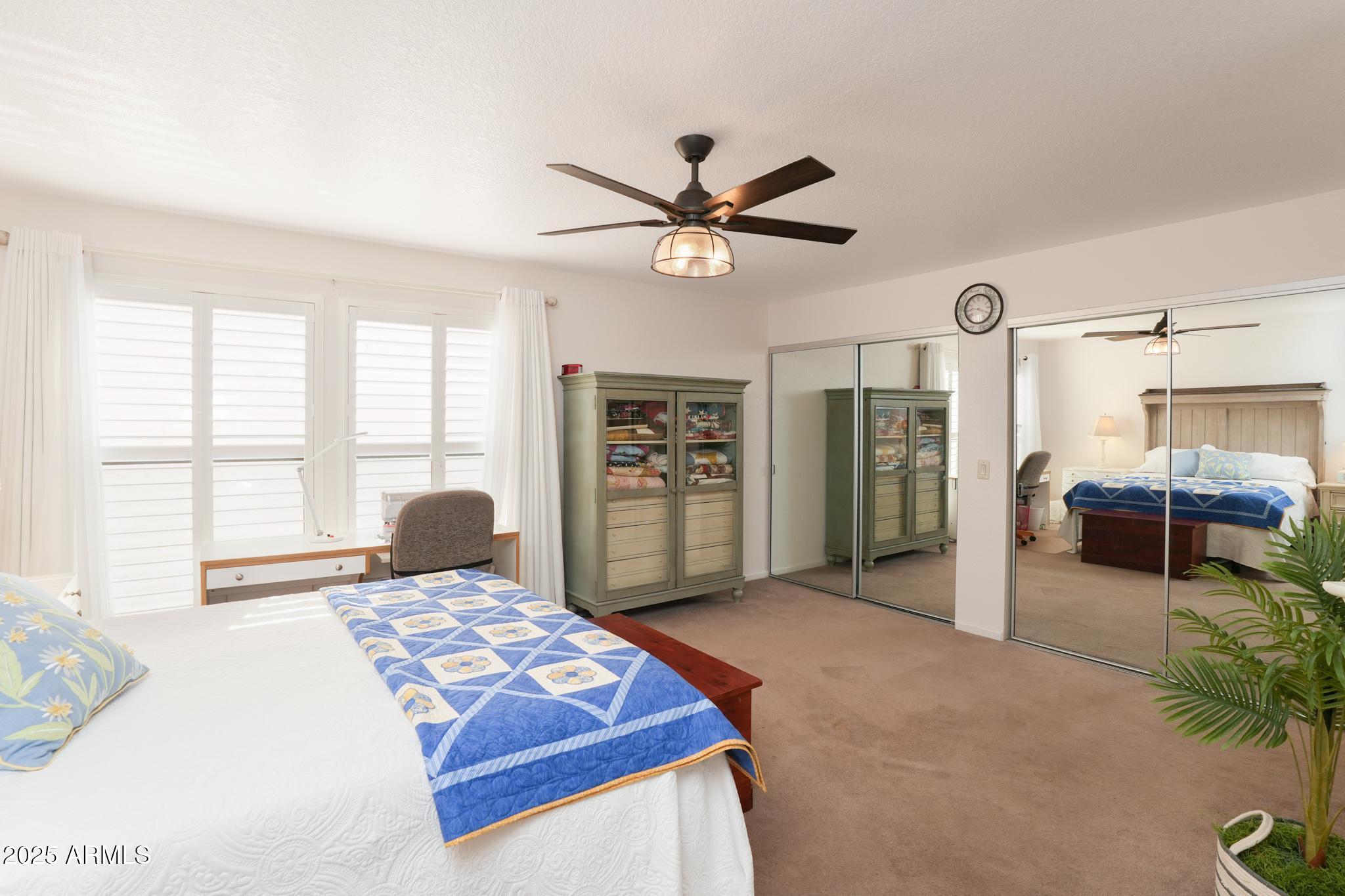 1665 Mountain View Road Cornville, AZ 86325 - Photo 17 of 46 a bedroom with a bed and a large window