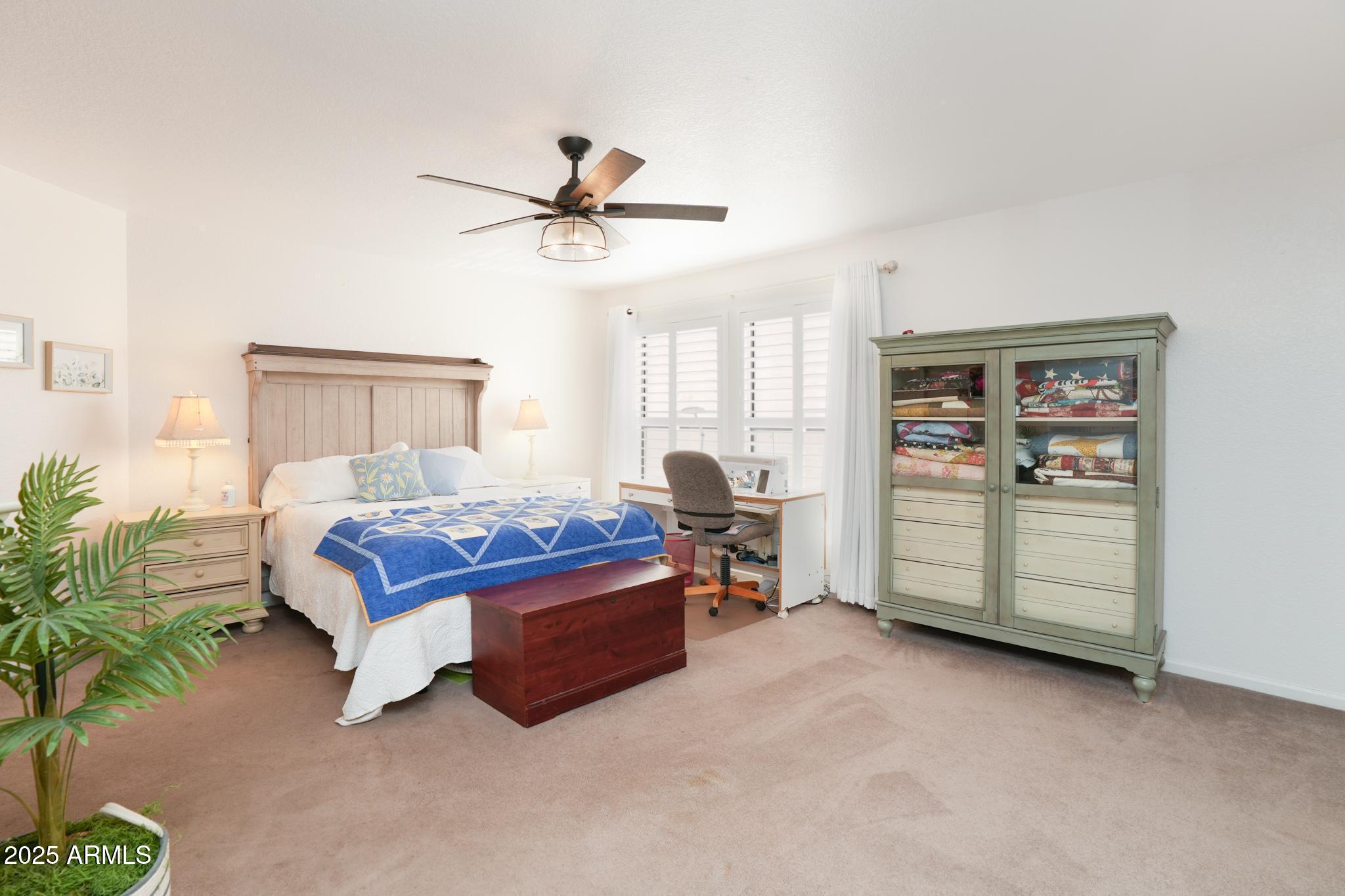1665 Mountain View Road Cornville, AZ 86325 - Photo 18 of 46 a spacious bedroom with a bed and a cabinets