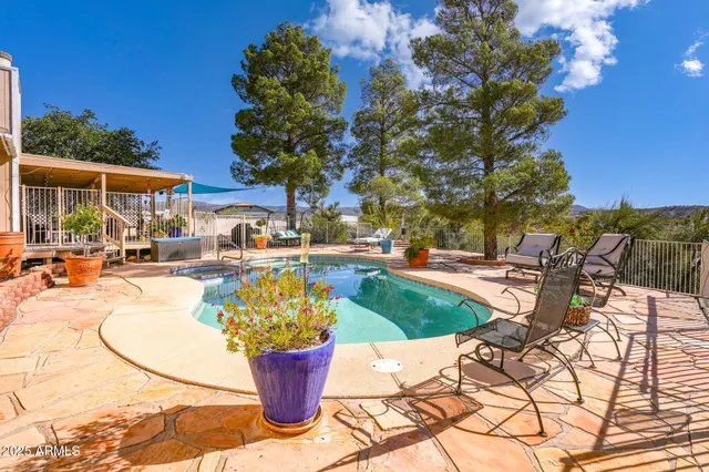 a view of a swimming pool with a patio