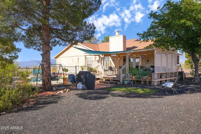 a view of house with outdoor space and sitting area