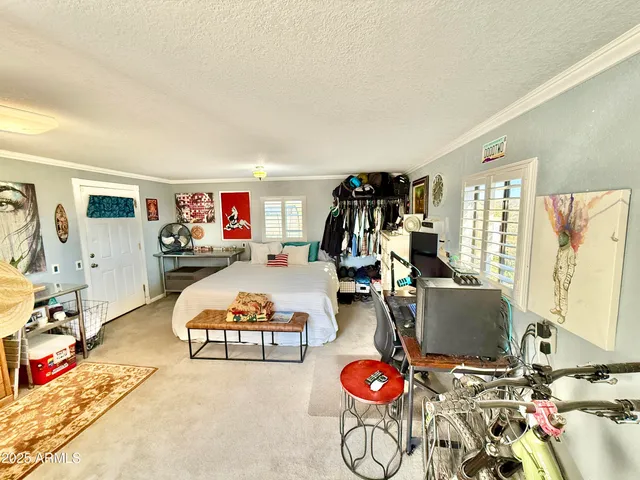 a view of a livingroom with furniture and a rug