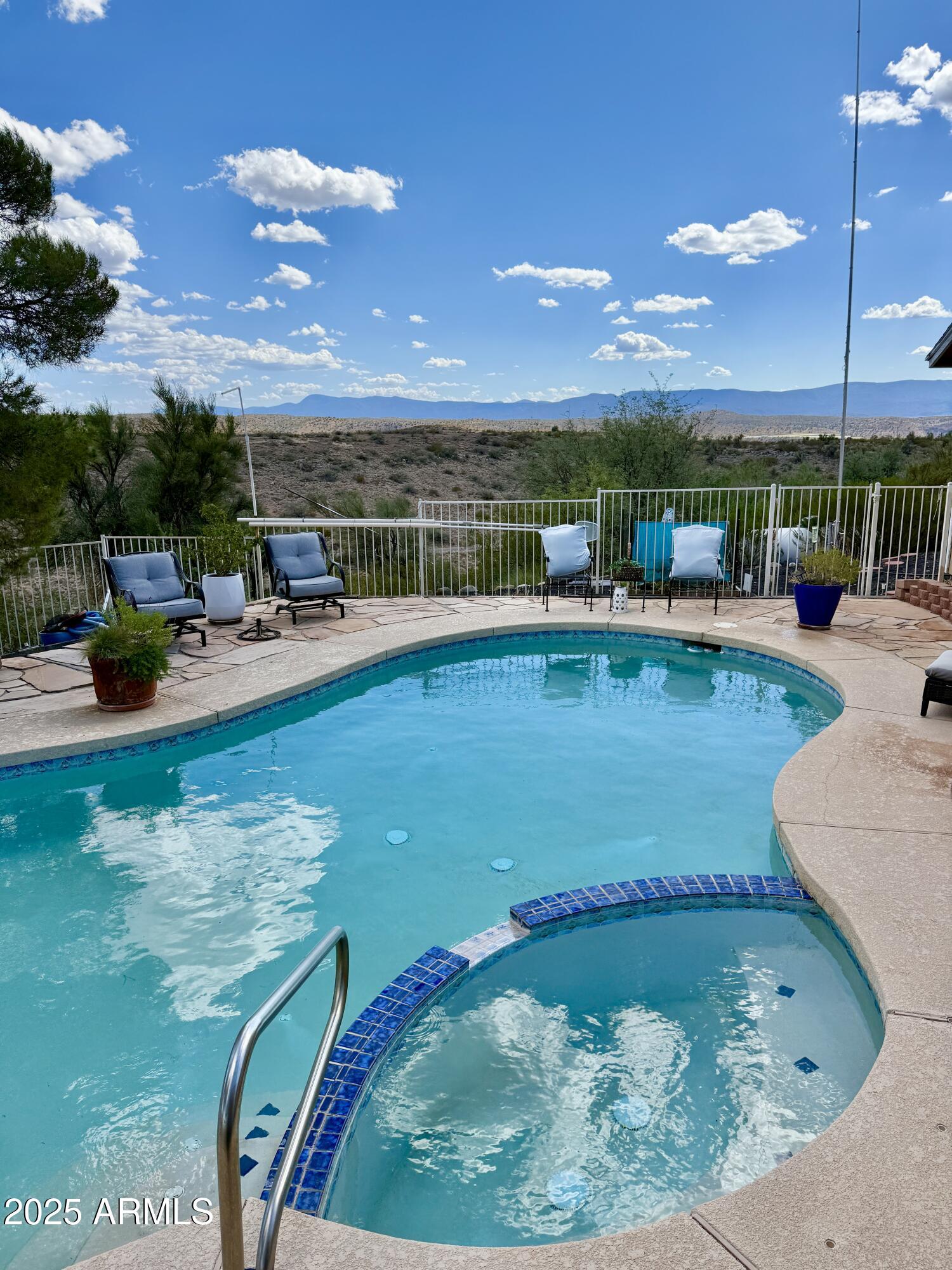 1665 Mountain View Road Cornville, AZ 86325 - Photo 4 of 46 a view of a swimming pool with a patio