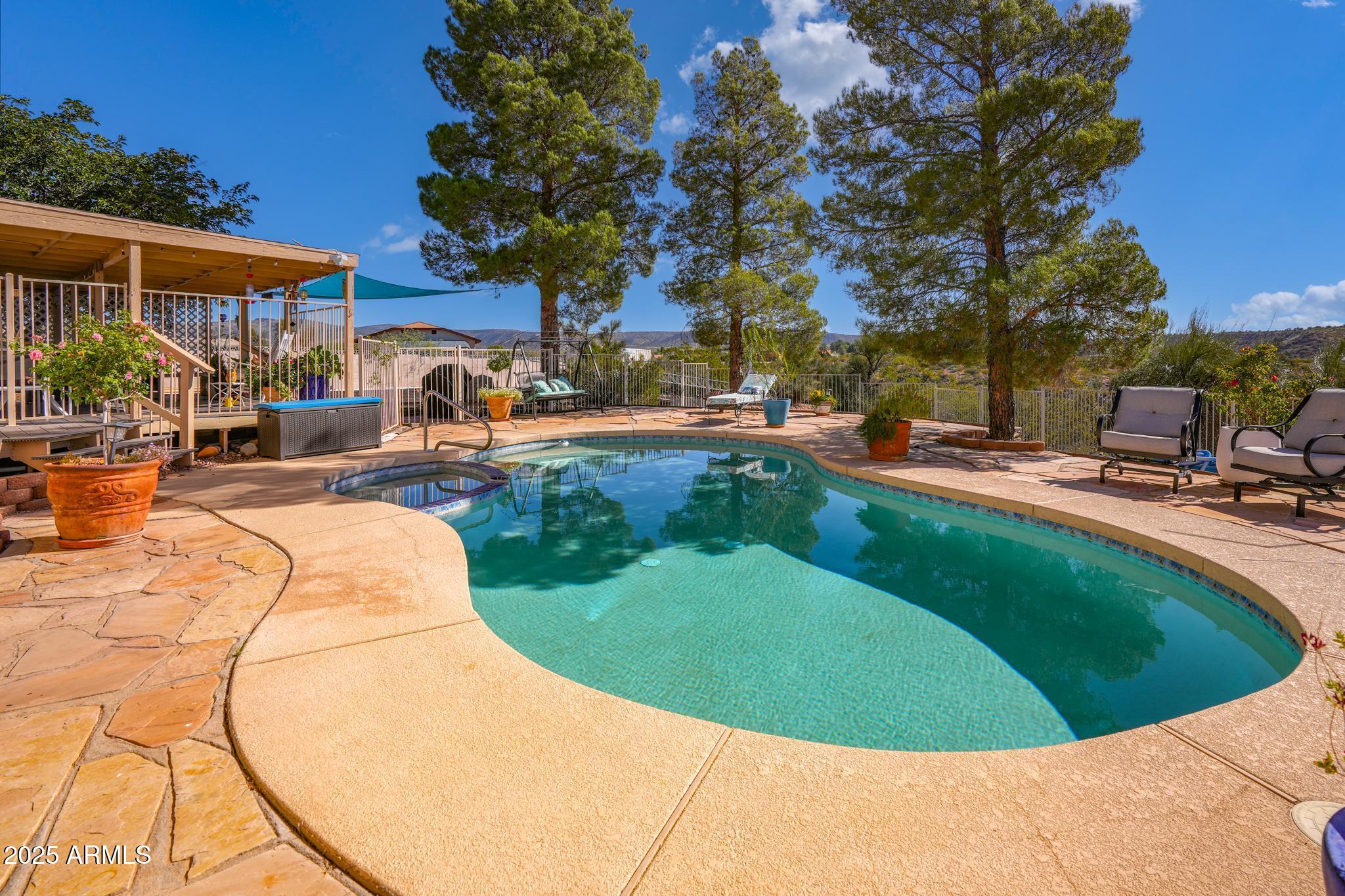 1665 Mountain View Road Cornville, AZ 86325 - Photo 6 of 46 a view of a swimming pool with a patio