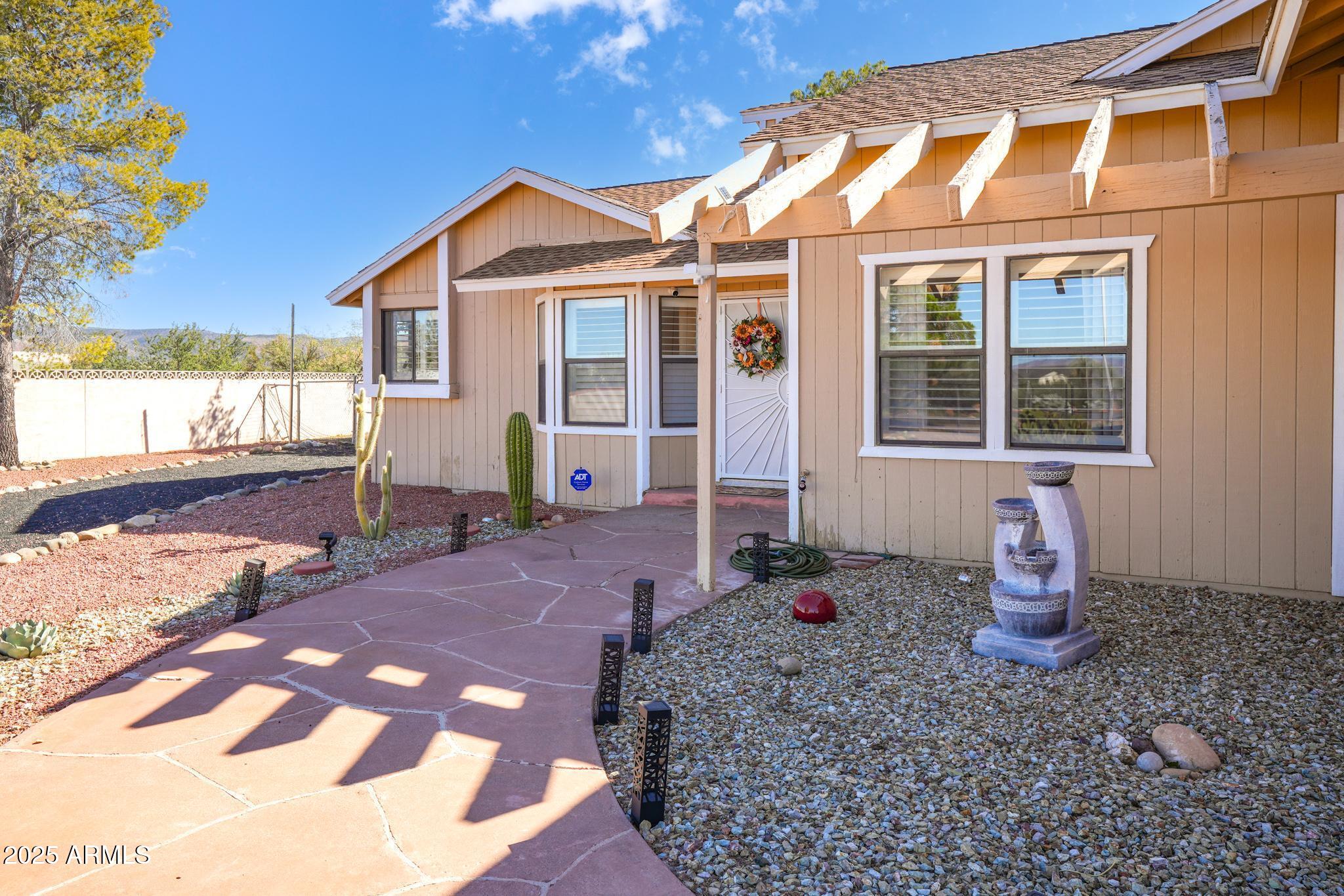 1665 Mountain View Road Cornville, AZ 86325 - Photo 7 of 46 a front view of a house with a yard