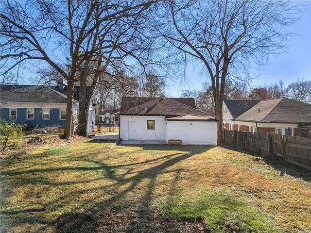 an aerial view of multiple houses with yard