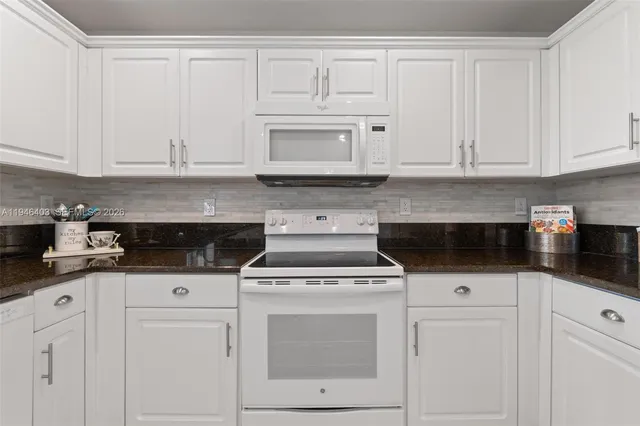 a view of a dinning table and chairs in patio of the house