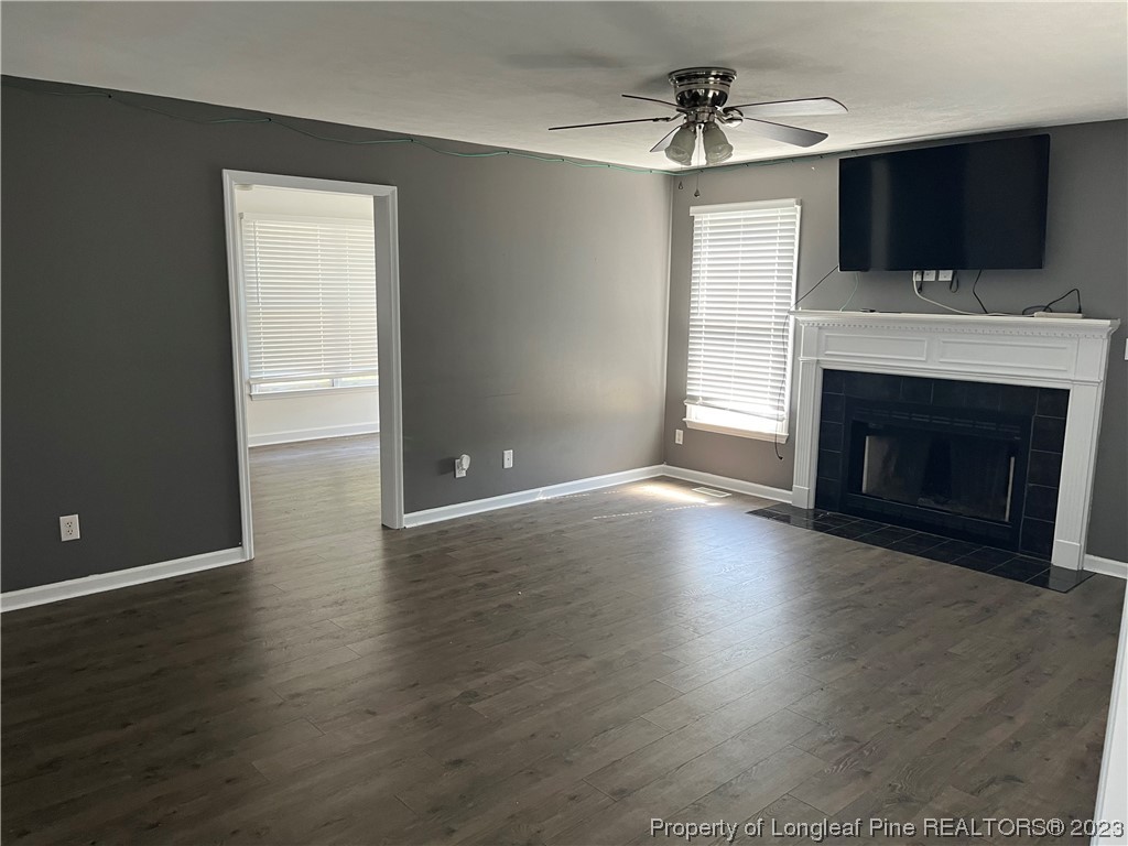 11 Overlook Road Cameron, NC 28326 - Photo 2 of 12 a view of a livingroom with a fireplace wooden floor and a window