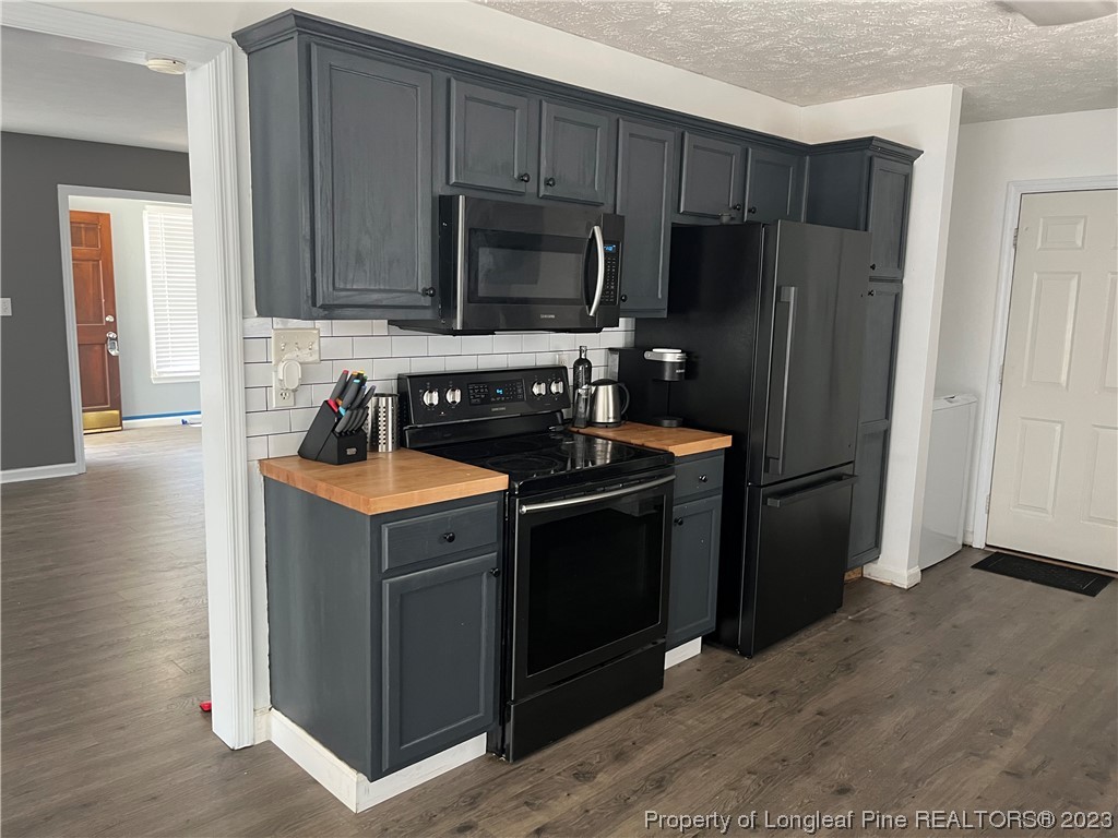 11 Overlook Road Cameron, NC 28326 - Photo 5 of 12 a kitchen that has a sink cabinets and stainless steel appliances