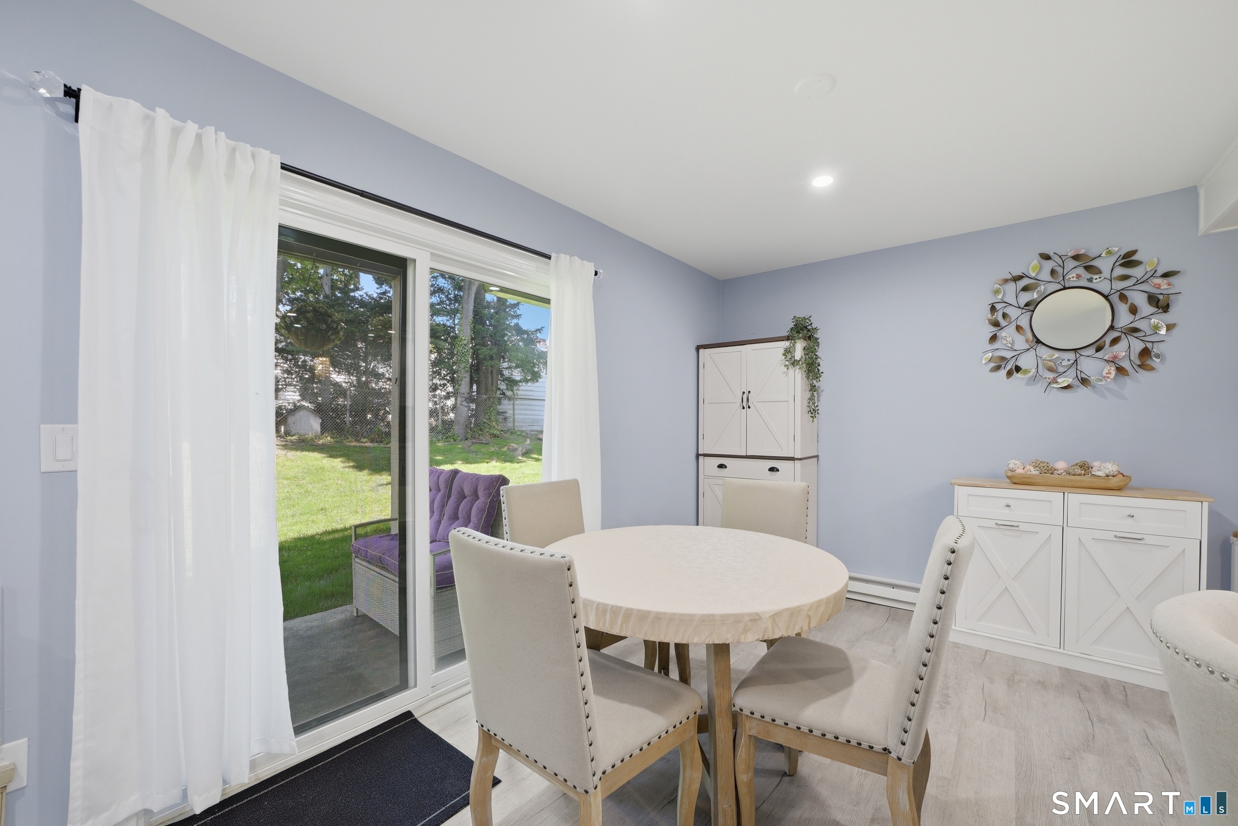 187 Flax Hill Road, Unit D1 Norwalk, CT 06854 - Photo 11 of 32 a view of a dining room with furniture window and wooden floor