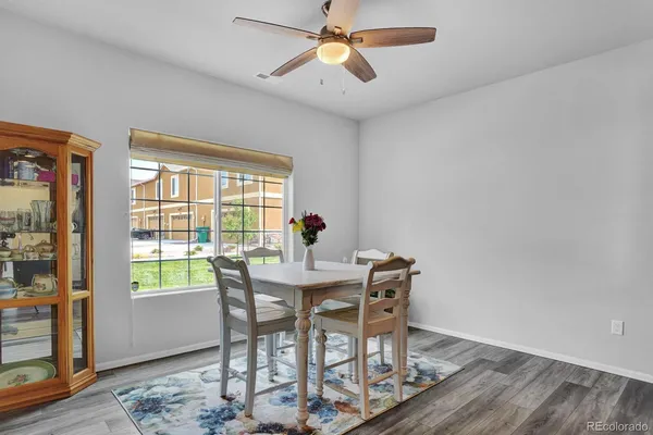 a view of a dining room with furniture window and wooden floor
