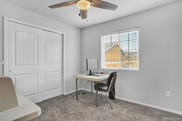 a bedroom with furniture and a window