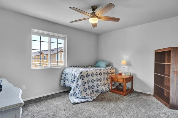 a bed room with a bed and a window