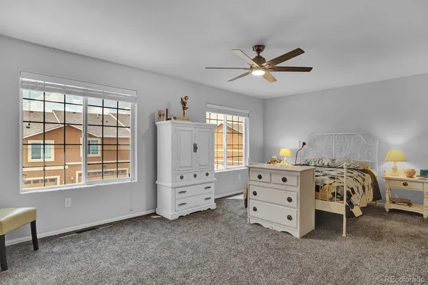 a view of bedroom with a bed and a chandelier