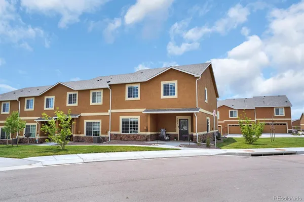 a front view of a residential houses with street