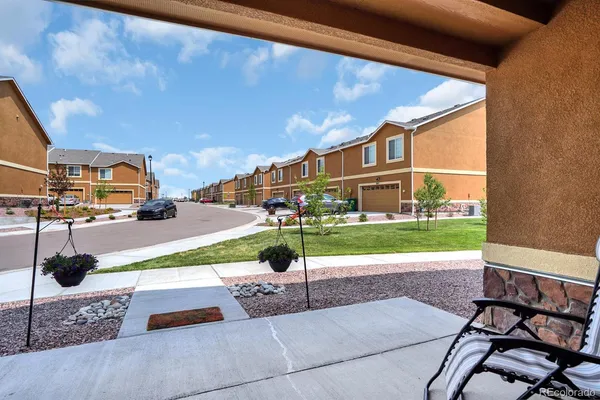 a view of a street with a building in the background
